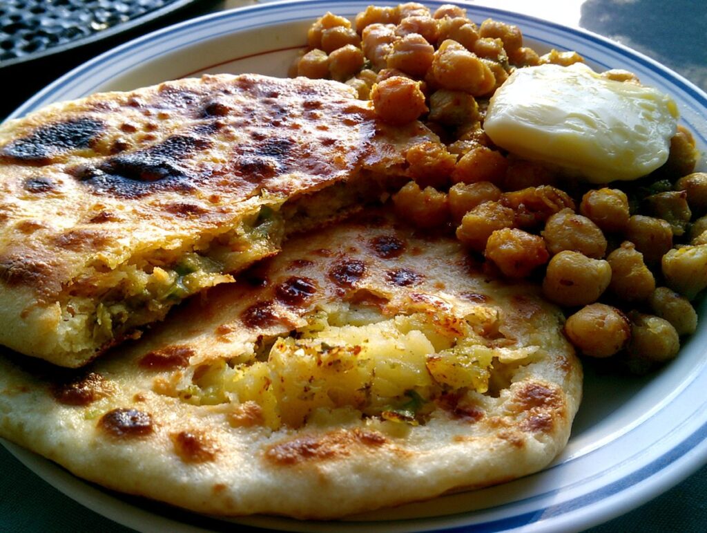 Amritsari kulcha — crisp tandoor-blistered flatbread stuffed with spiced potato, Amritsar, Mughal Corridor
